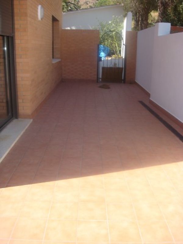 Apartment at the entrance of the village next to the playground